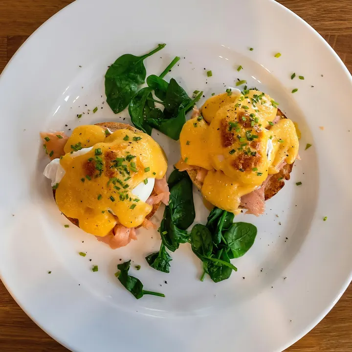 Two eggs bene with hollandaise, salmon and spinach, from above