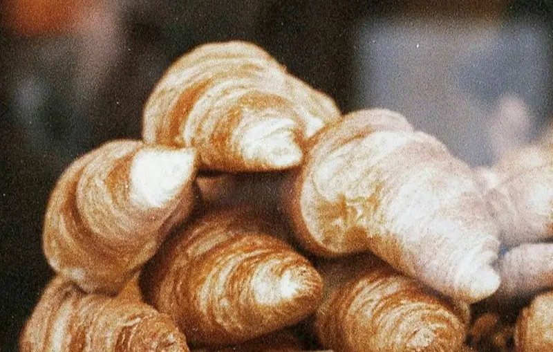 Fresh croissants piled up in the cabinet